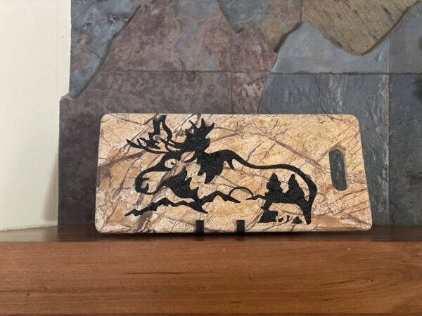 17" x 8" brown forest marble Sand Blasted with a moose and bear scene. The stones veins are enhanced.