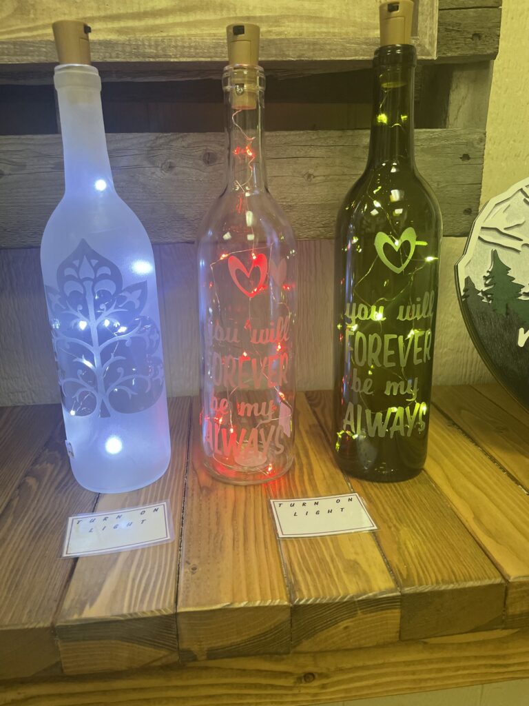 SAND BLASTED WITH LIGHTED CORK WINE BOTTLES