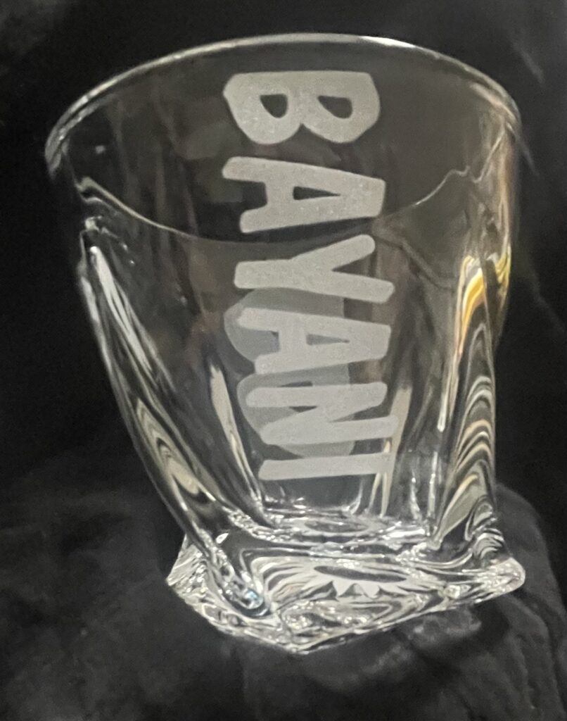 SPECIAL ORDER LAST NAME VERTICAL ON TWISTED ROCKS GLASS.